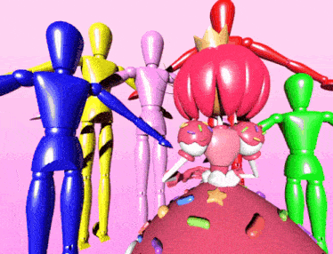 a group of mannequins are standing around a giant cupcake
