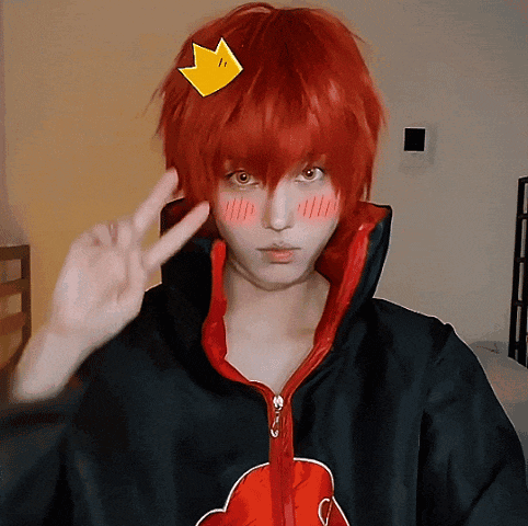 a person with red hair and a yellow arrow on their head