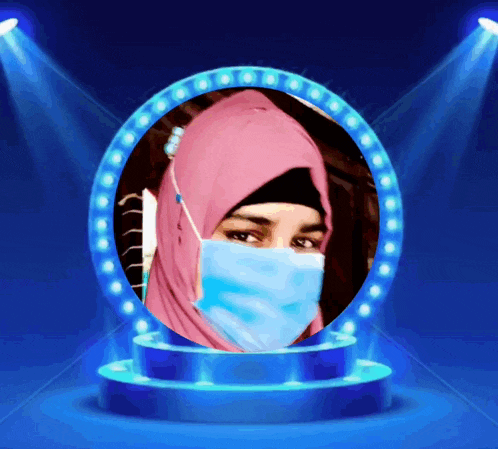 a woman wearing a mask and a pink hijab