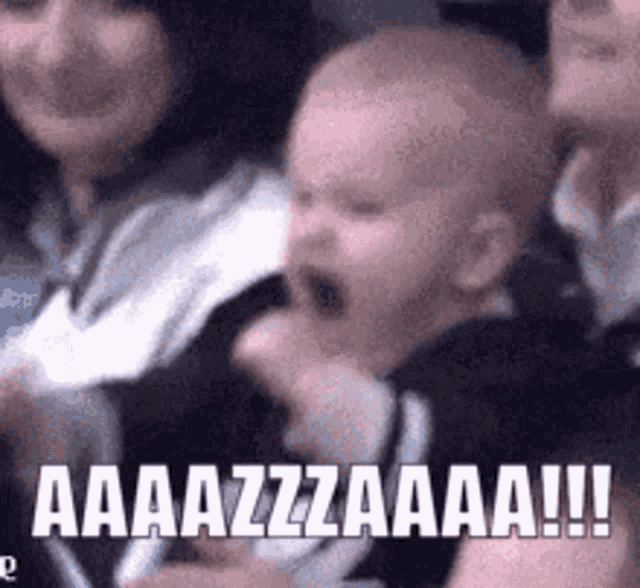 a baby is crying while sitting in a crowd with the words aaazzzaaa !!! written on the bottom