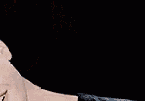a close up of a man 's face with a smile on it .