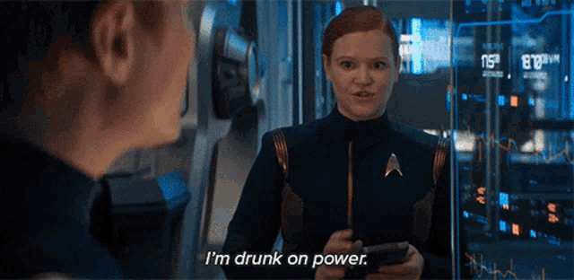 a woman says i 'm drunk on power while holding a phone