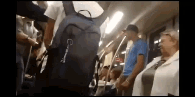 a group of people are riding on a train .