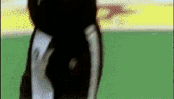 a blurred image of a person standing on a field