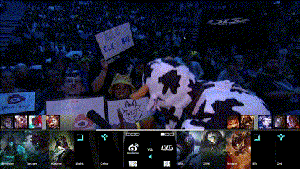 a man in a cow costume holds a sign that says big elk boy