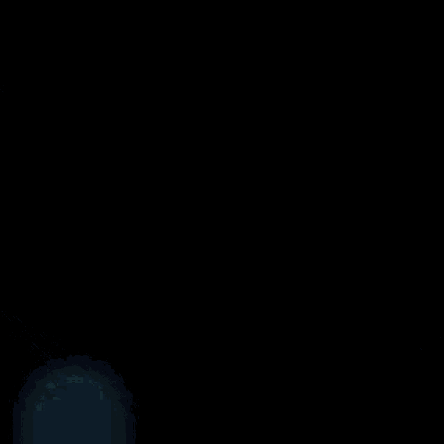 a blue light is shining through a dark background
