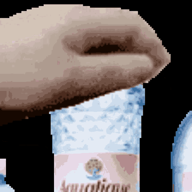 a pixelated image of a person holding a bottle of aquafina