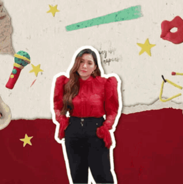 a woman in a red top and black pants stands in front of a wall with a microphone and stars