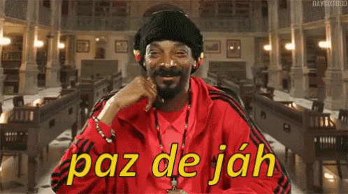 snoop dogg is wearing a red jacket with the words paz de jah on the front