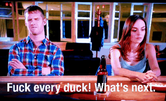 a man and woman sit at a bar with the words fuck every duck what 's next on the screen