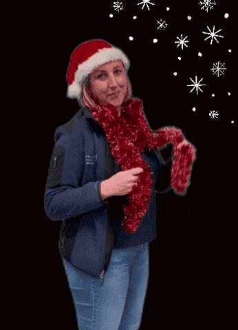 a woman in a santa hat is holding a red tinsel