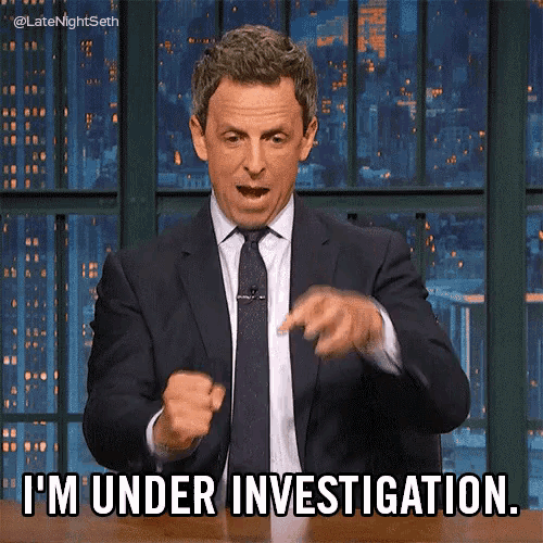 a man in a suit and tie is saying i 'm under investigation .