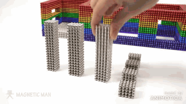a person is playing with a magnetic man game