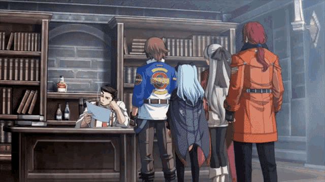 a group of people standing in a room with a man wearing a blue jacket that says ' samurai ' on it