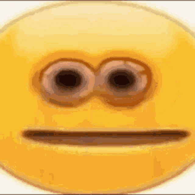 a yellow smiley face with two eyes and a slight smile on it .