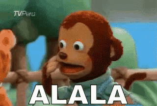 a stuffed monkey with the word alala written on the bottom