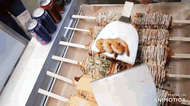 a can of coca cola sits on a shelf next to a tray of food