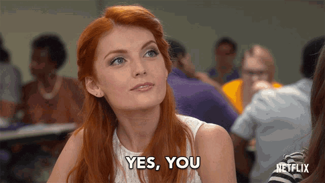 a woman with red hair says yes you