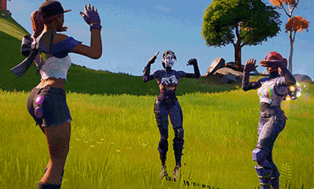three women are standing in a grassy field with their arms outstretched in a video game .