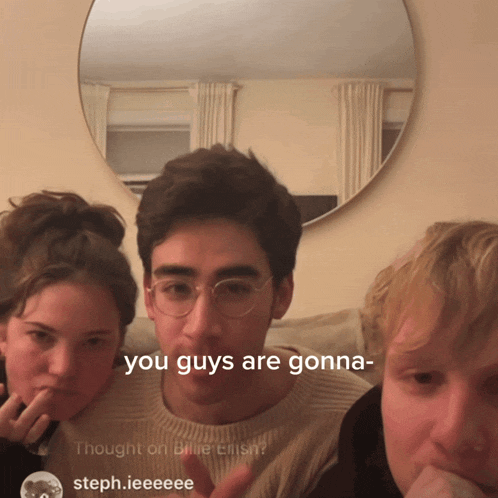 a group of people are sitting in front of a mirror and one of them says you guys are gonna