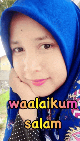 a woman wearing a blue hijab with the words waalaikum salam written on the bottom