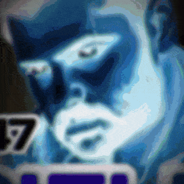 a close up of a man 's face with the number 17 in the lower right corner