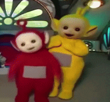 two teletubbies are standing next to each other