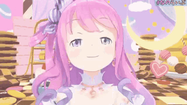 a 3d anime girl with pink hair and purple eyes is smiling in front of a stack of cookies .