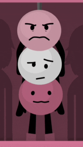 three pink and white balls with faces on them hanging from a rope