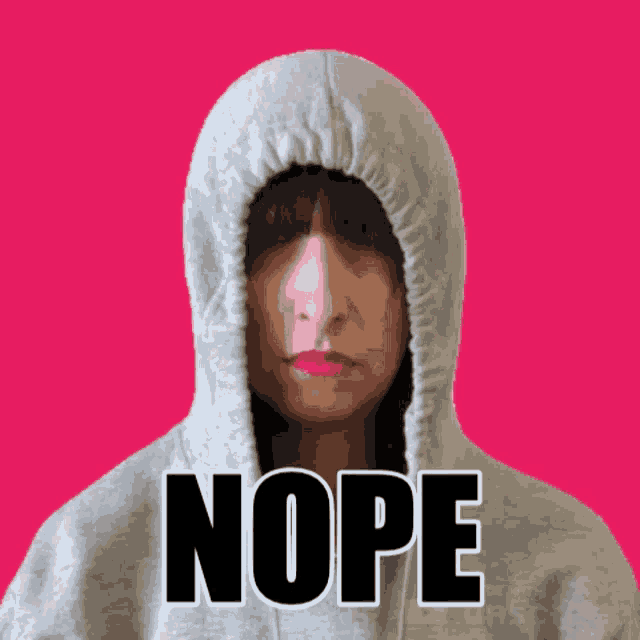 a woman wearing a hoodie with the word nope written on it