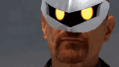 a man with a beard is wearing a mask with yellow eyes
