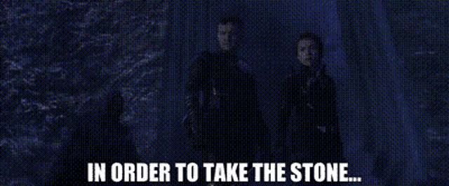 a couple of people standing next to each other with the words `` in order to take the stone '' .