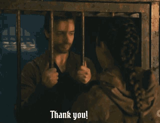 a man and woman in a cage with the words thank you