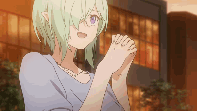 a girl with green hair and purple eyes has her hands folded in front of a building