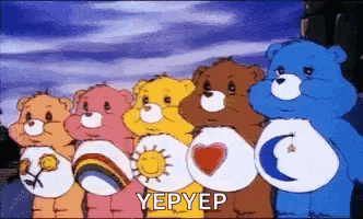 a group of care bears standing next to each other in a row .