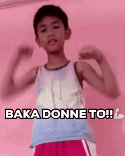 a young boy is flexing his muscles and says baka donne to