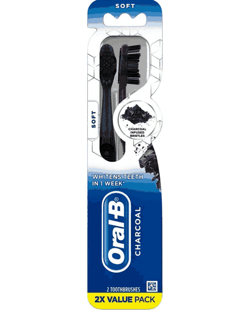 a soft oral b charcoal toothbrush with a purple handle