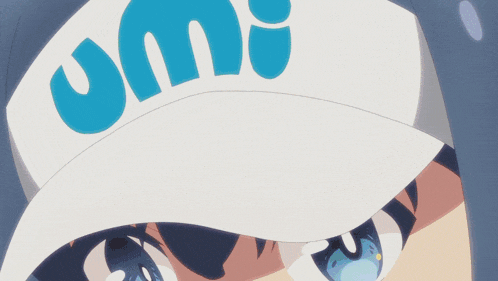 a close up of a girl wearing a hat that says umi on it