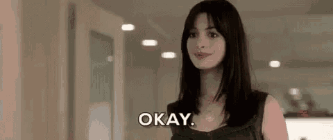 a woman is smiling and saying okay .