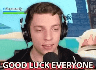 a man wearing headphones is talking into a microphone and says good luck everyone
