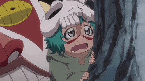 a little girl with a skull mask on her head looks surprised