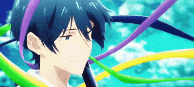 a close up of a person 's face with ribbons coming out of it
