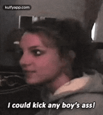 a woman is talking to a boy and saying `` i could kick any boy 's ass ! ''