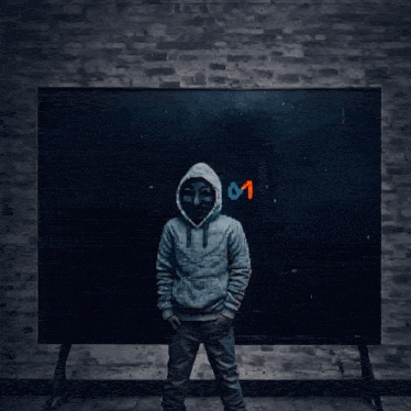 a man wearing a white hoodie and a black mask