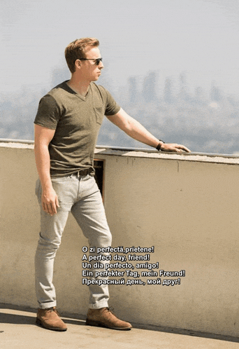 a man is standing on a balcony with a poem written in another language