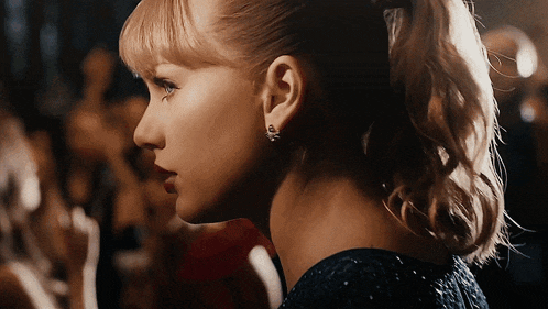 a close up of a woman 's ear with earrings