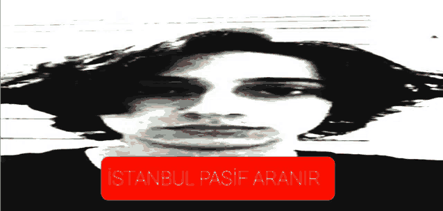 a black and white photo of a man with a red istanbul pasif aranir sticker