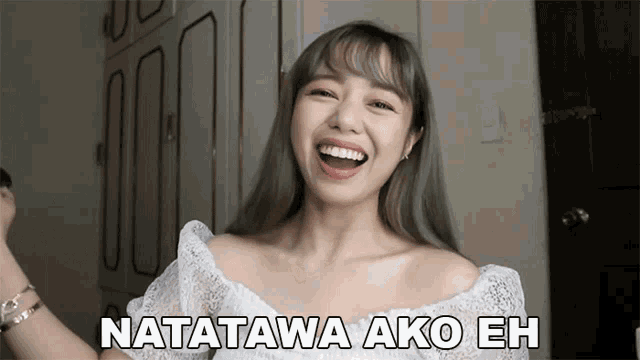 a woman in a white lace top is laughing with the words natatawa ako eh above her