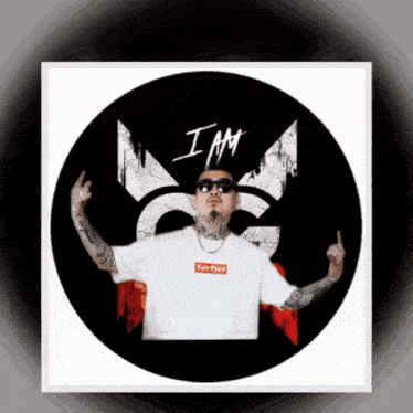 a man wearing a white shirt with a red box that says i am