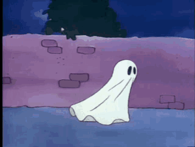 a cartoon ghost is walking across a brick wall .
